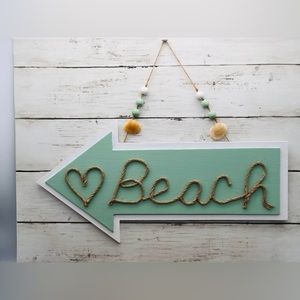 Handcrafted beach arrow wall sign